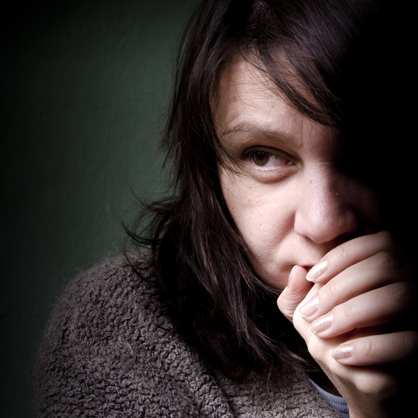 picture of woman with cold hands to her mouth