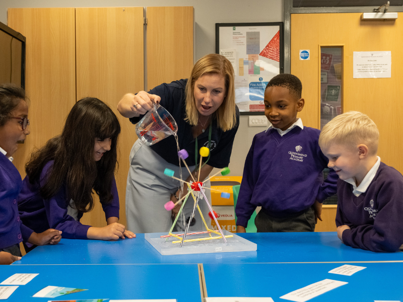 Education expert Michala uses a model to explain energy to school children