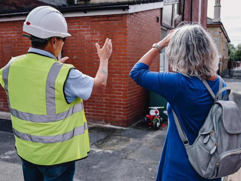 Contractor explains retrofit solutions on a terraced house