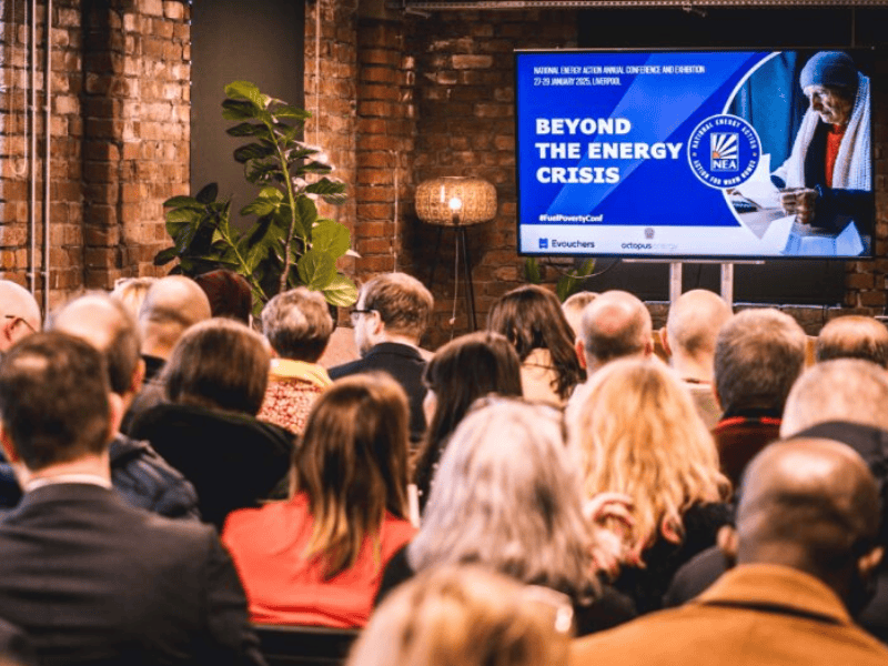 Seminar room with brick walls and projector showing Beyond the Energy Crisis
