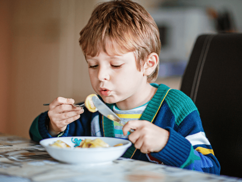 Child eating pasta